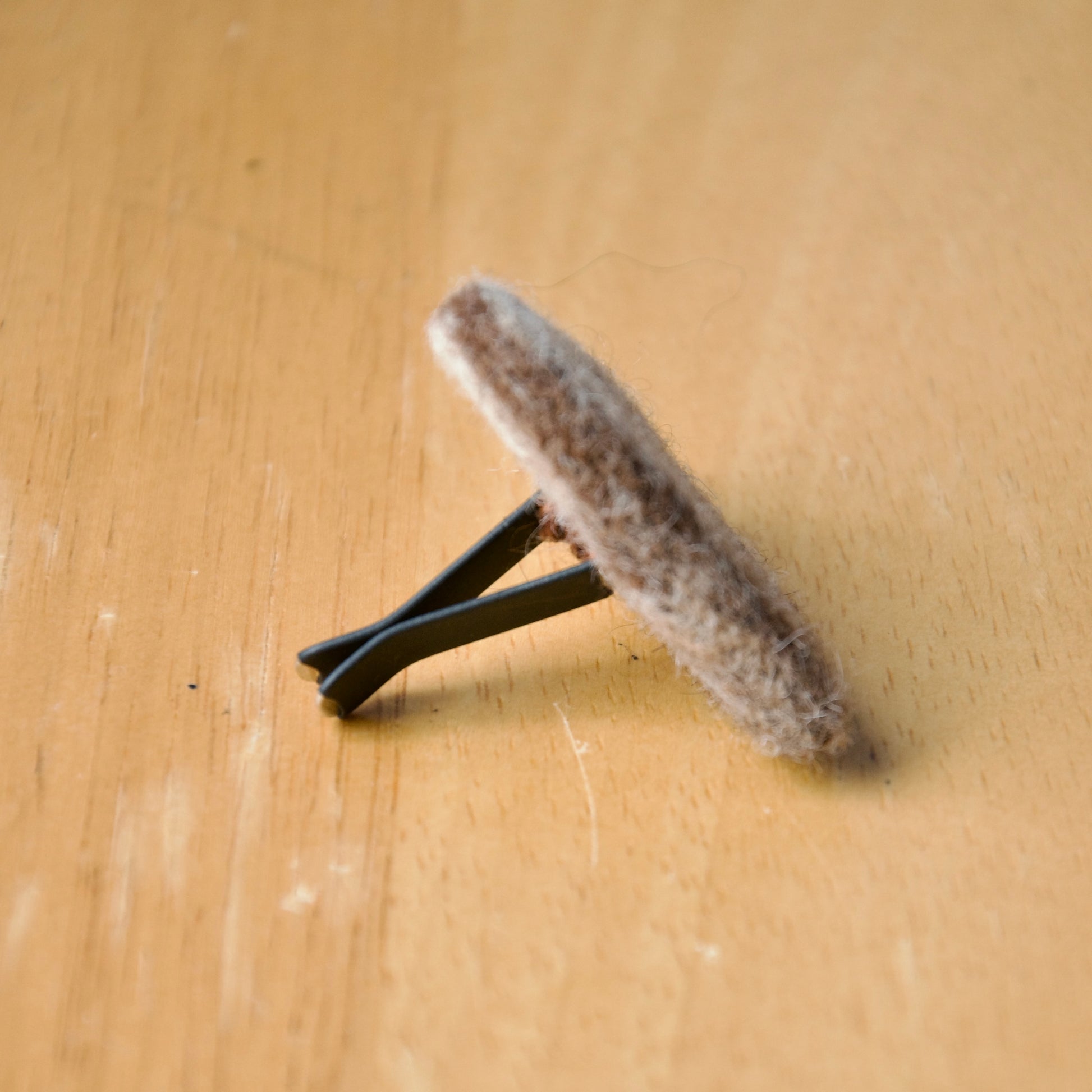 Needle felt air freshener in the shape of a brown heart