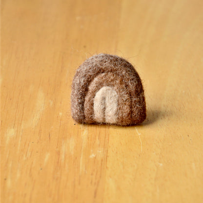 Needle felt air freshener in the shape of a brown rainbow