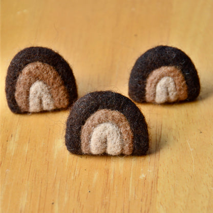 Three handmade felt air fresheners designed to clip to a car vent, displayed on a wooden surface.