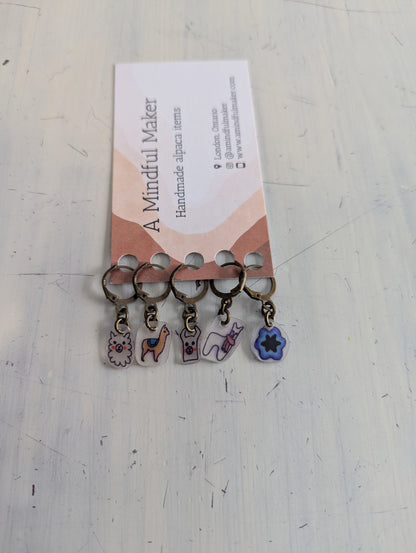 Set of keychains with charms on a card labeled 'A Mindful Maker' on a light gray background.