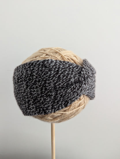 Knitted headband on a gray background