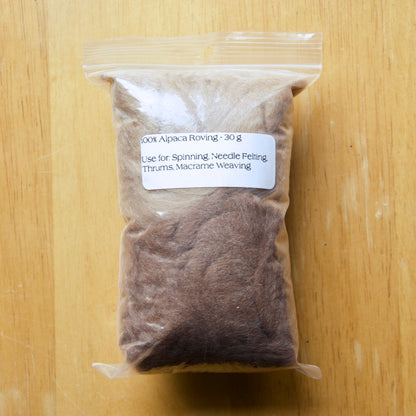 Brown alpaca roving in a clear bag
