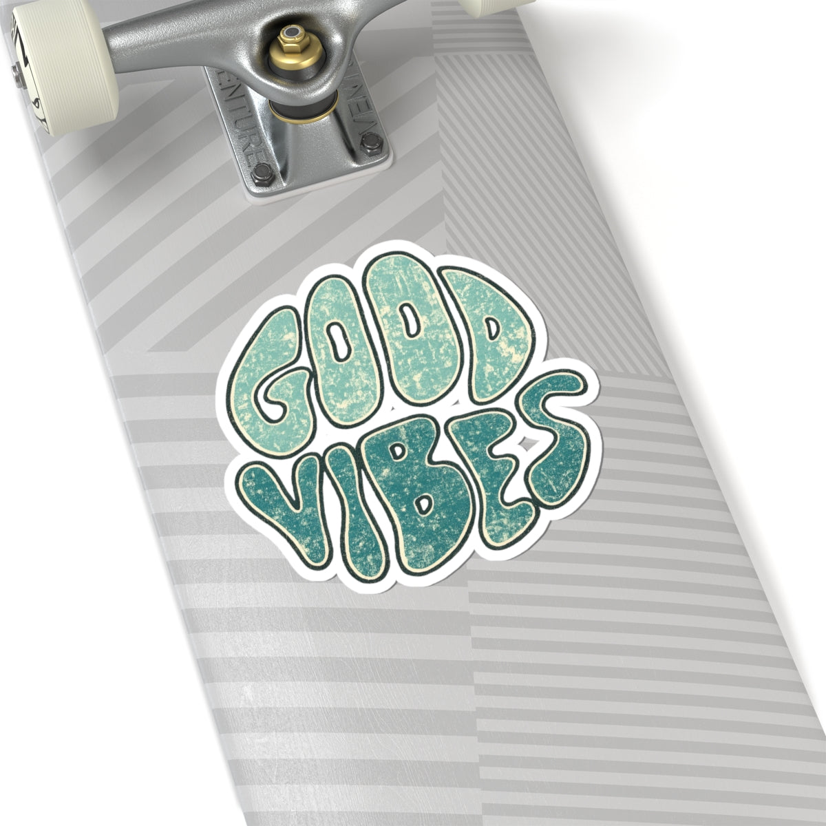Skateboard with 'Good Vibes' sticker on a white background